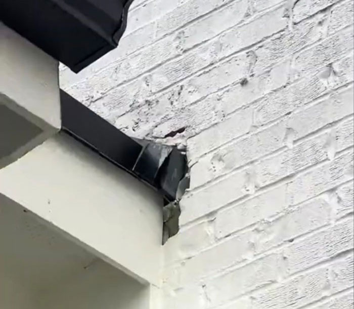 Damaged corner of a $1,600,000 home built 2 years ago, showing poor construction quality.