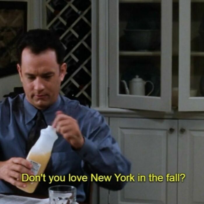 Man pouring orange juice in a kitchen with the text "Don't you love New York in the fall?" capturing a '90s moment.