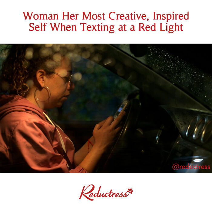 Woman creatively texting at a red light, humorously depicted, from Reductress, highlighting fake headlines.