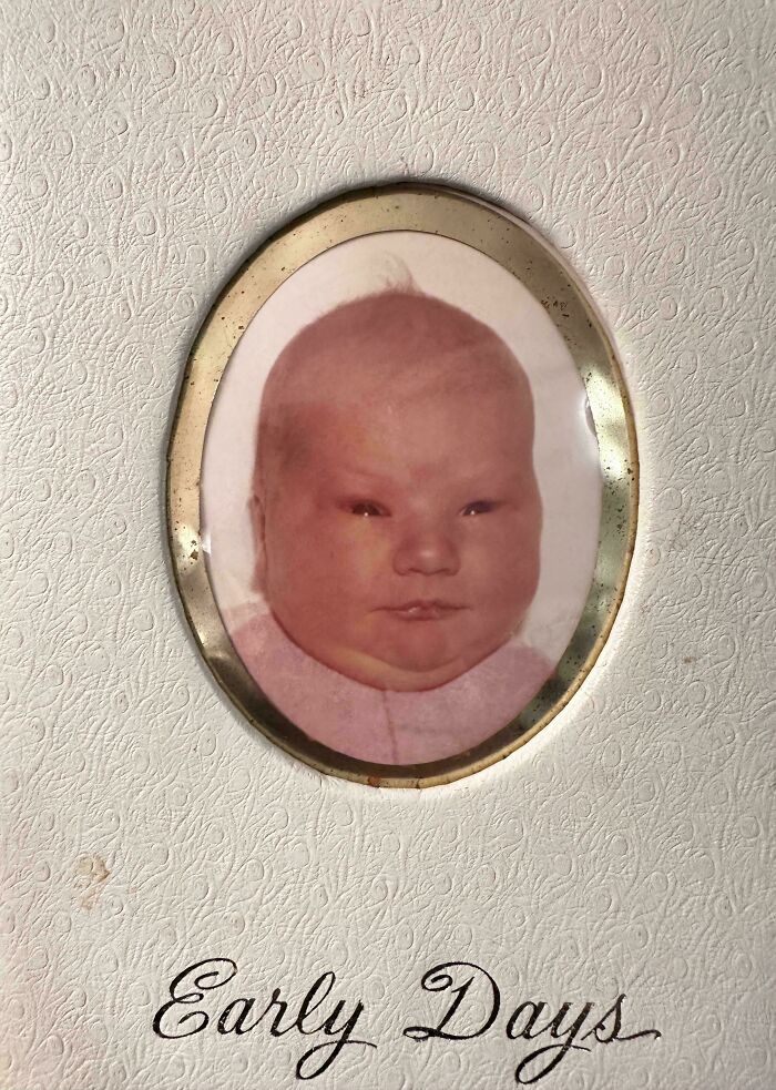 Framed baby photo labeled "Early Days," capturing a classic blunder years moment.