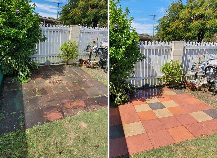 Power washing results: a patio before and after cleanup, with tiles looking vibrant next to a white fence and garden chairs.