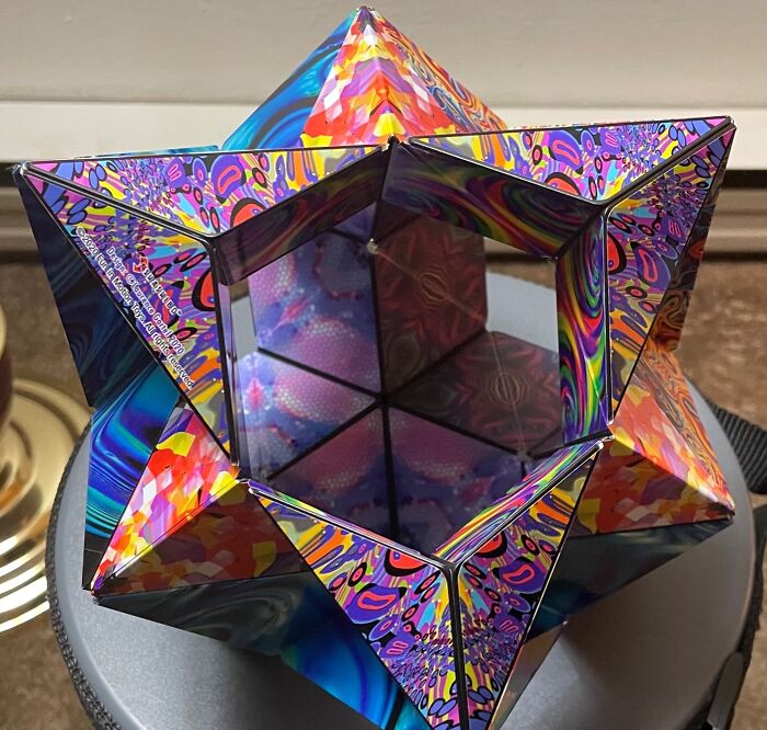 Colorful geometric kaleidoscope toy with intricate patterns, perfect for creative shopping for a 12-year-old gift idea.