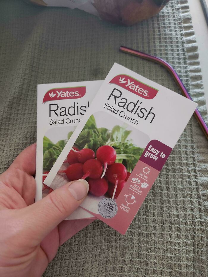 Radish seed packets held in hand, exemplifying an online shopping fail.