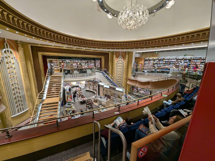 "Modern bookstore in renovated historic building, showcasing one of the best building conversions with elegant decor."