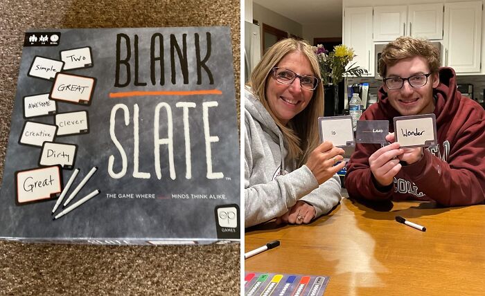 Box of the compact and straightforward game Blank Slate next to two people smiling and holding up game cards at a table.