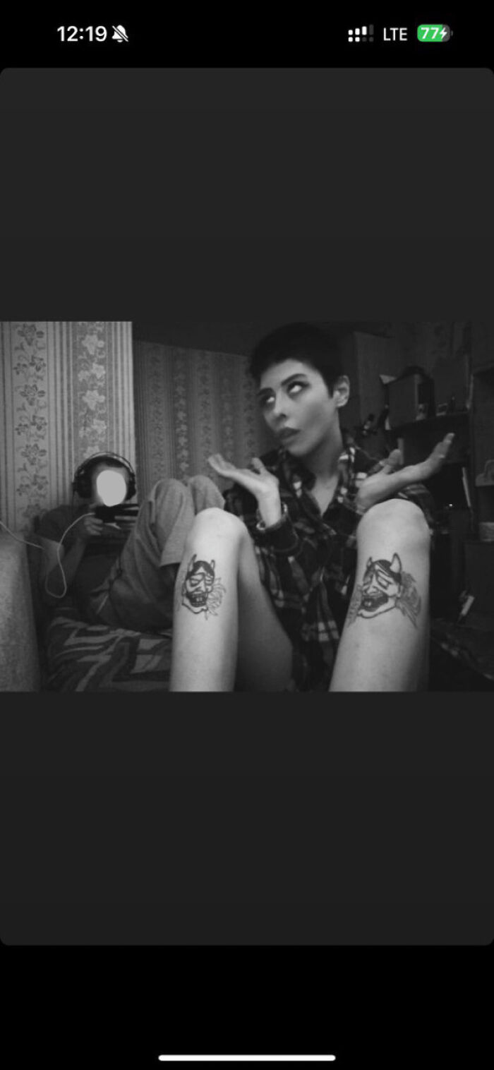 Person striking a playful pose in plaid shirt with tattoos, embodying the essence of "Blunder Years."