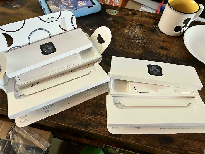 Online shopping fail: empty product boxes on a wooden table, highlighting a humorous delivery mistake.