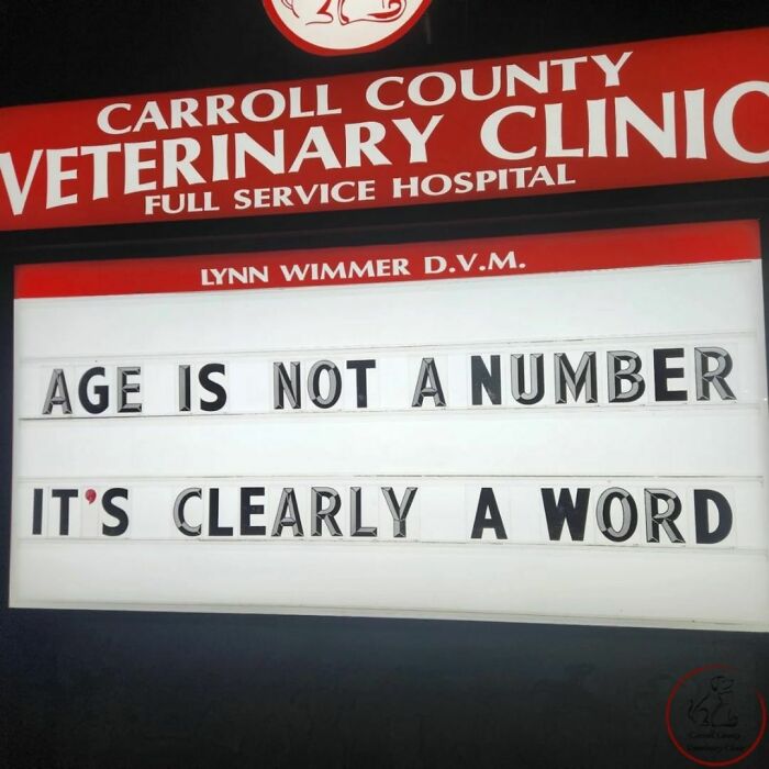Veterinary clinic sign with a funny joke saying, "Age is not a number, it's clearly a word," in bold letters.