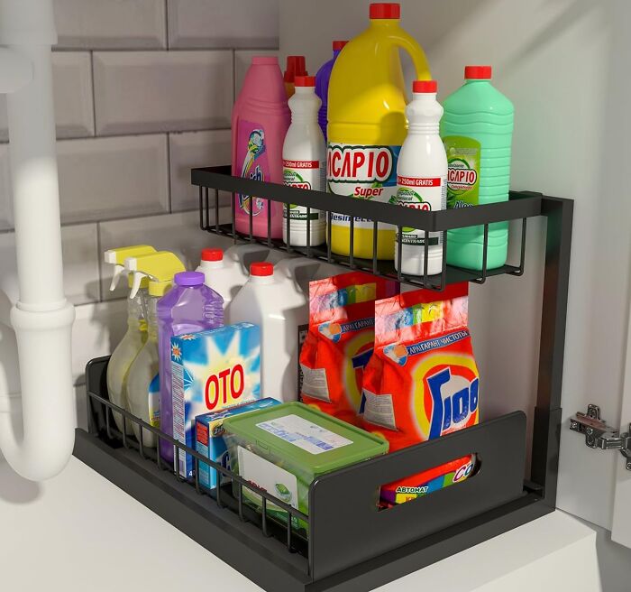 Kitchen cabinet organizer with cleaning supplies and detergents, one of the most-wished-for Amazon finds for home storage.
