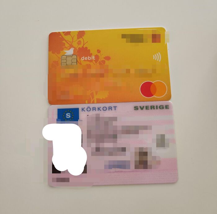 Swedish ID card next to an orange debit card, showcasing a funny online shopping fail.