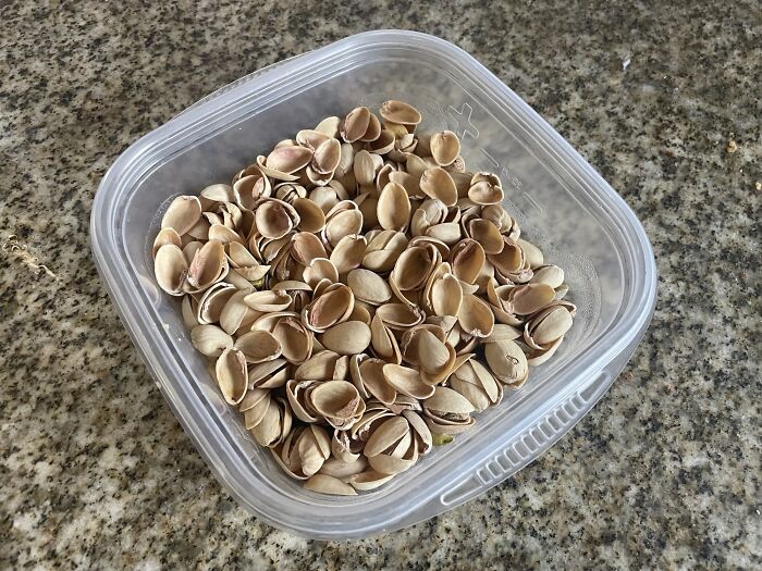 Container of pistachio shells on a kitchen countertop, representing infuriating habits.