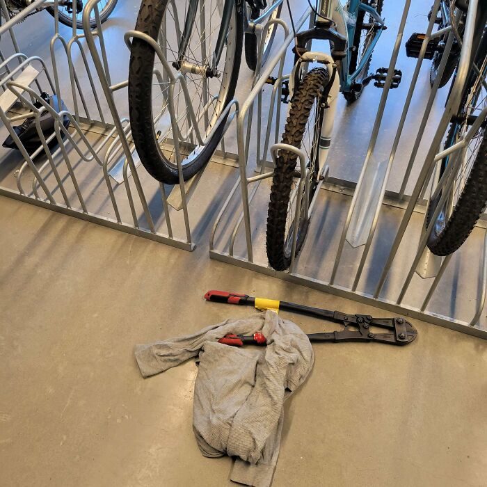 Bike rack with theft evidence, including bolt cutters and a shirt, illustrating regrettable spending.