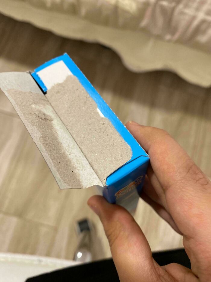 Unopened cereal box with missing cereal, illustrating irritating things.