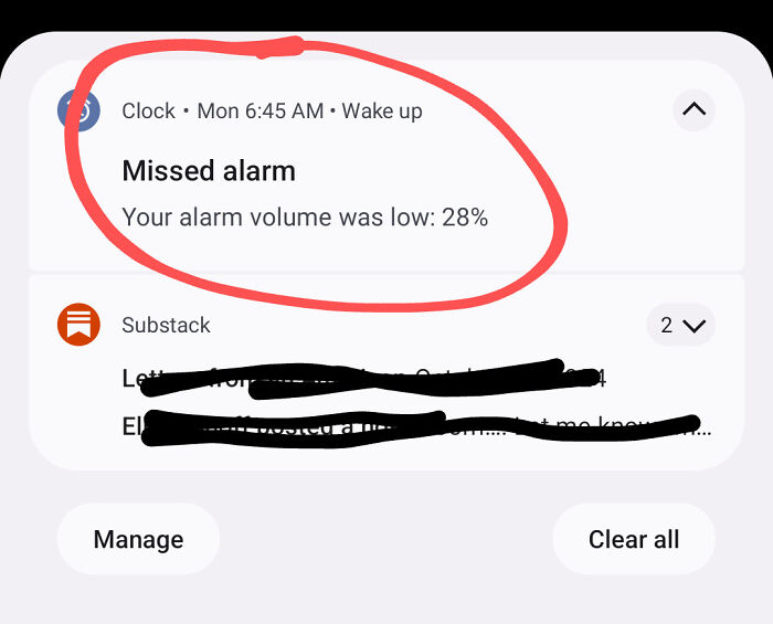 Missed alarm notification circled in red, showing low volume of 28%, illustrating mildly infuriating tech issue.