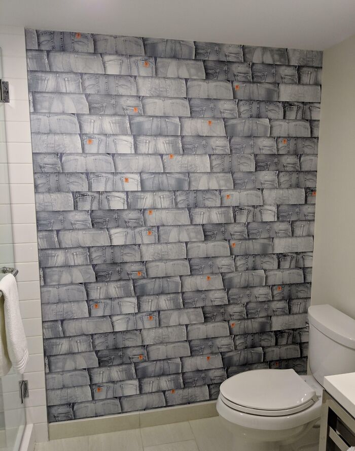 This Hotel Bathroom "Tile" Wall Is Actually Just Numerous Pictures Of Jeans 