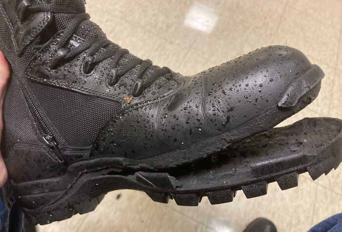 Worn-out black boot with detached sole, symbolizing regret after months of saving.