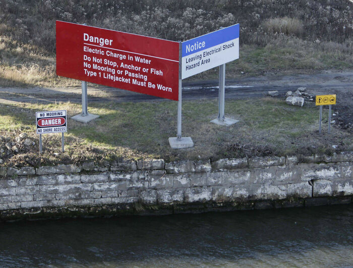 A Warning Sign Close To The Electric Fish Barrier In The Chicago Sanitary And Ship Canal To Prevent The Asian Carp From Reaching The Great Lakes