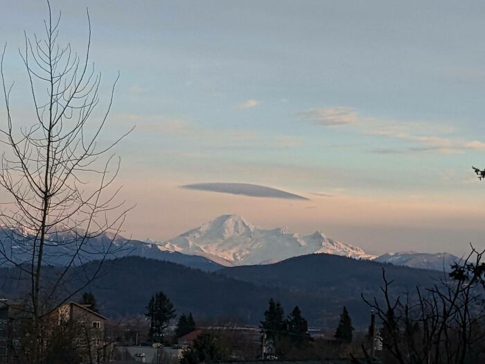 A Lenticular Cloud Over Mt. Baker. As Observed From The Fraser Valley In Bc, Mt. Baker's North Side View With A Lenticular Cloud Hanging On Top Of This Beautiful Active Volcano With A Glacial, Snow Covered Peak