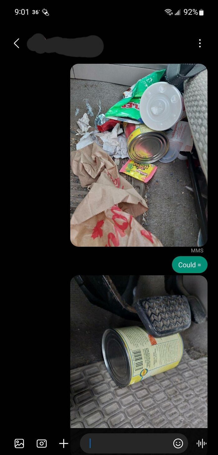 Messy car floor with trash and a canned item visible, possibly highlighting infuriating behavior.