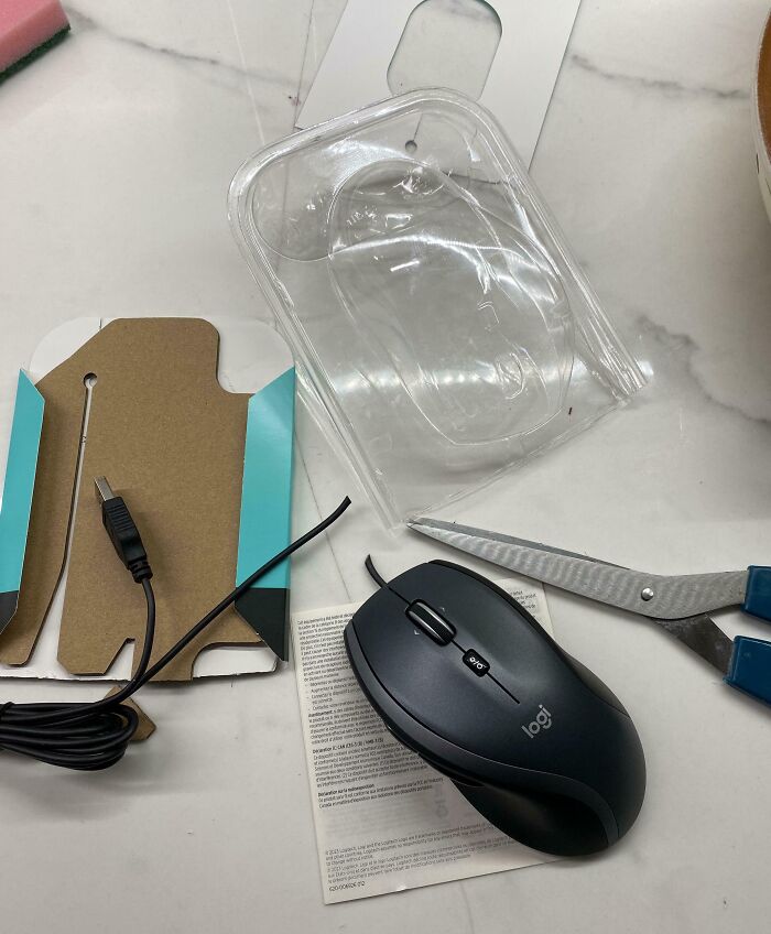 Wife Opening Her New Mouse Packaging