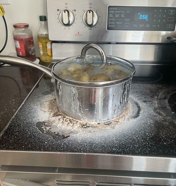 Pot boiling over on a stove, illustrating a kitchen mishap often linked with infuriating wives and girlfriends in humorous contexts.