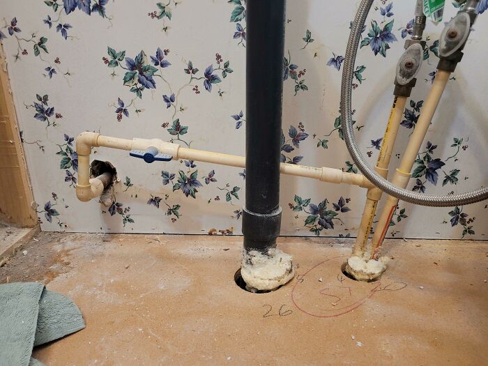 I'm Renovating My Bathroom. This Is How My House's Previous Owners Installed The Outdoor Spigot