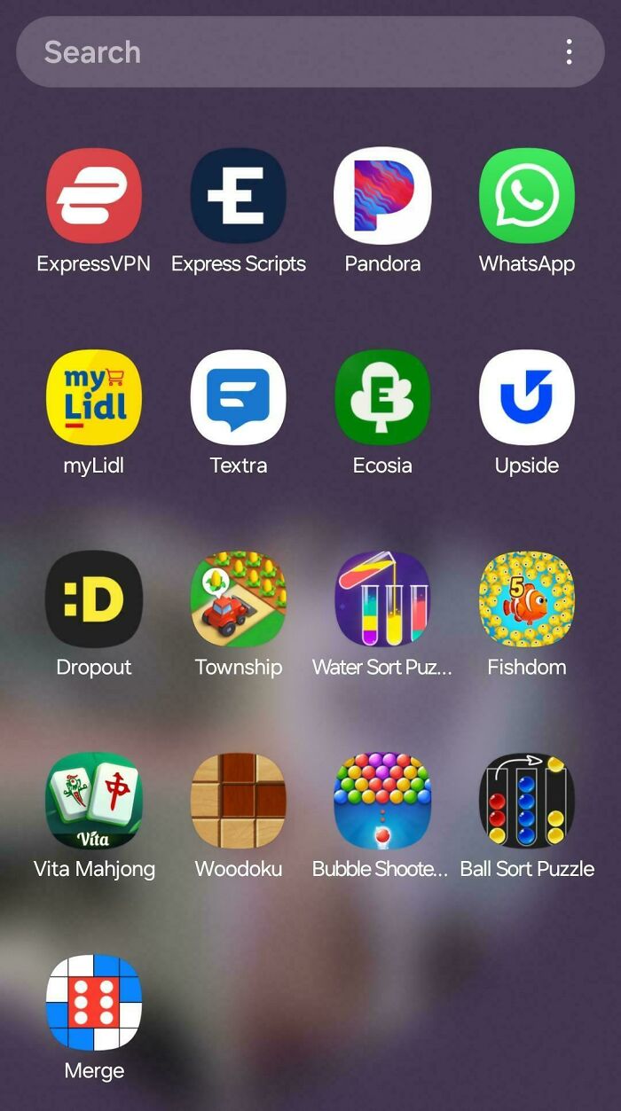 Phone screen displaying various app icons, representing mildly infuriating app organization.