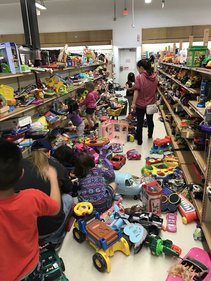 Children making a mess in a store aisle filled with scattered toys, illustrating people being jerks.