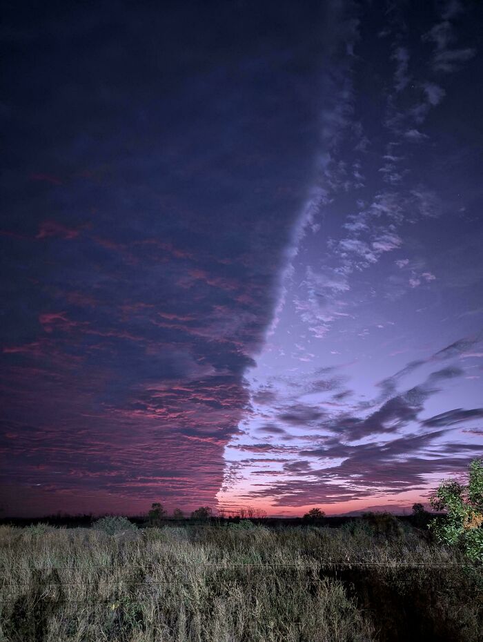 Dramatic, interesting sky with a sharp cloud divide creating an unusual, not-photoshopped twilight landscape.