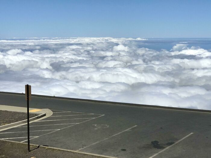 Road above the clouds, showcasing an interesting and not photoshopped perspective.
