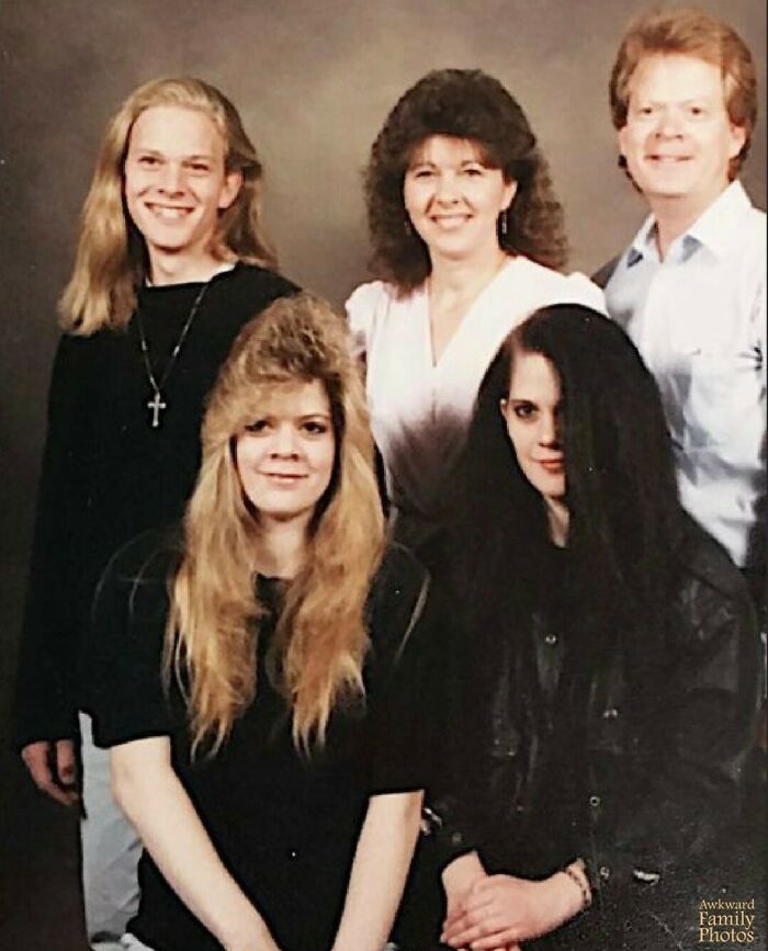 A family portrait with 80s hairstyles, showcasing awkward family photo trends.