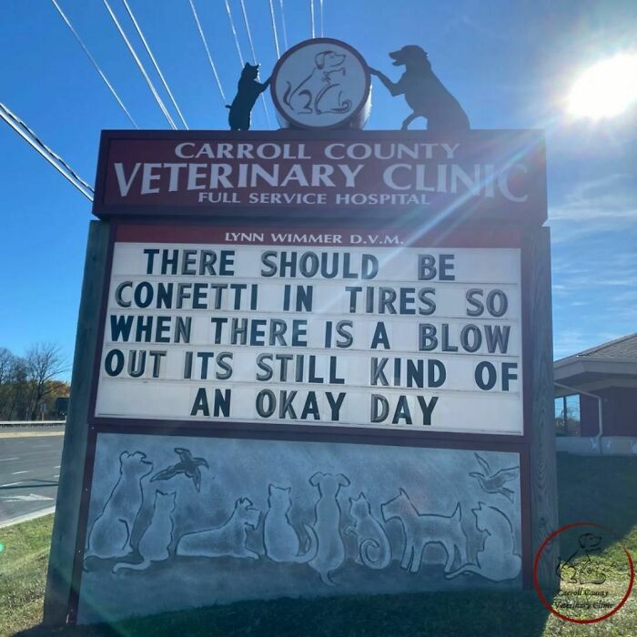 Veterinary clinic sign with a humorous joke about confetti in tires to improve days with a blowout.