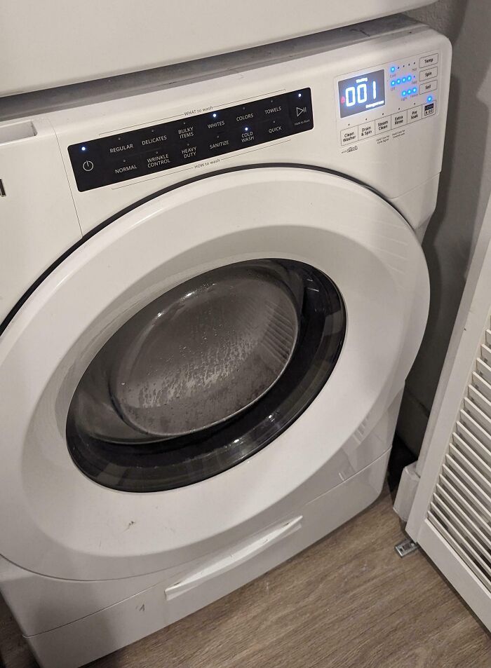 Washing machine displaying 1 minute left, yet continuing for longer, illustrating an irritating experience.