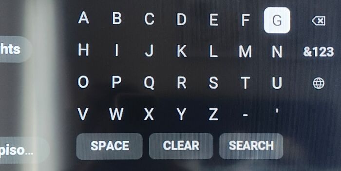 Alphabet keyboard on a touchscreen missing the letter "N," causing irritation.