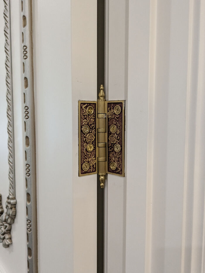 Elegant door hinge design with intricate patterns, showcasing exceptional craftsmanship.