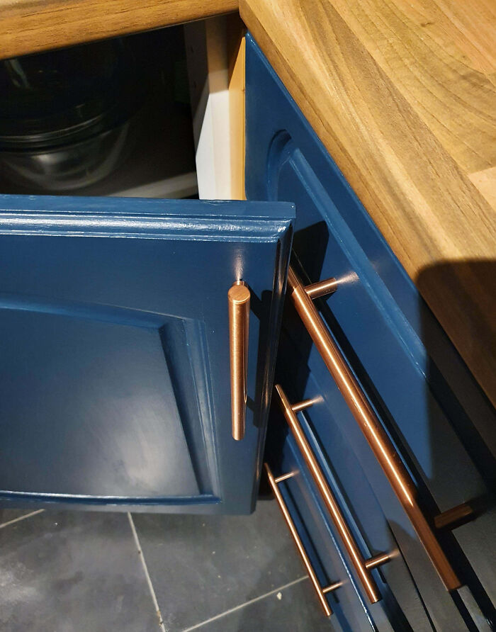Home improvement fail with blue cabinet and mismatched drawer, highlighting bad design.