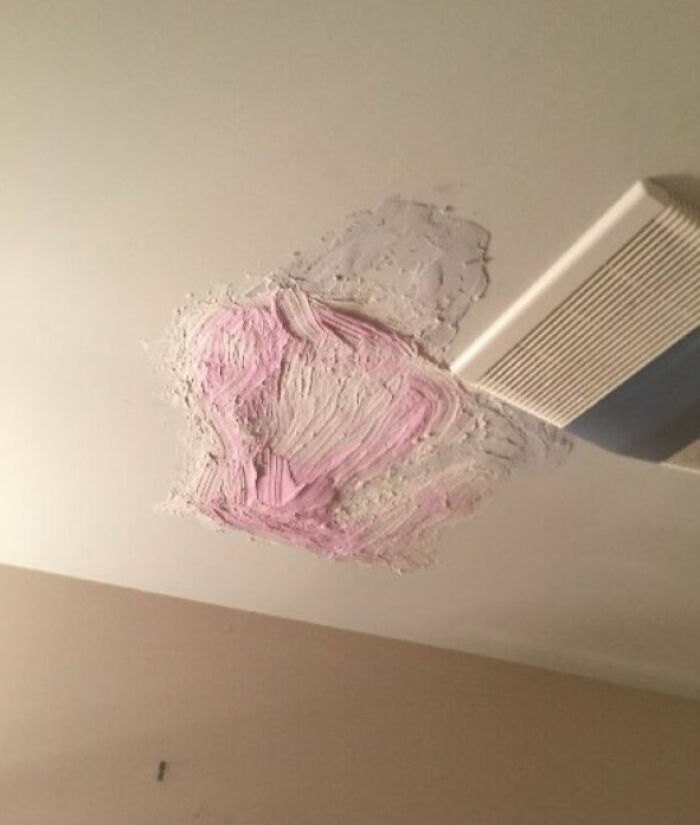 Home improvement fail with uneven purple plaster on a white ceiling near a vent.