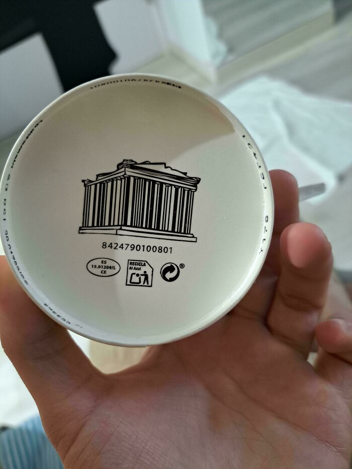 Designer crafted cup base featuring barcode and historic building sketch.