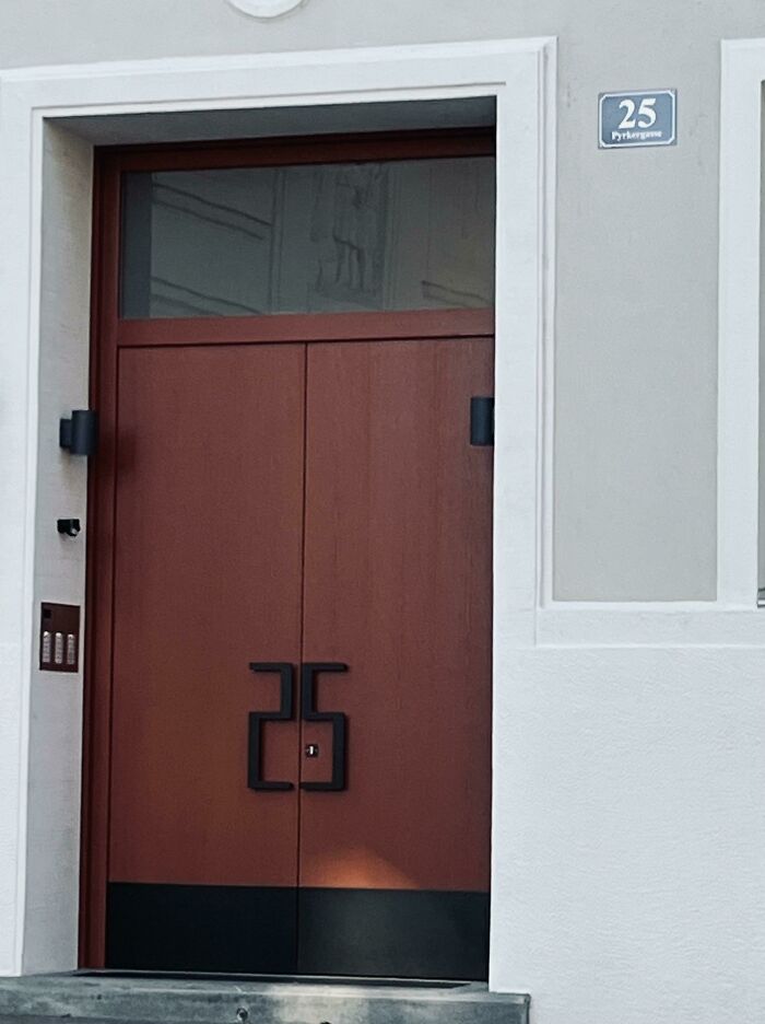 Modern door design with unique handle, showcasing exceptional designer skills in architecture.