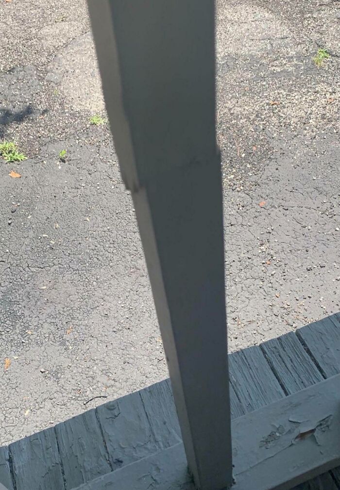 Misaligned railing obstructing view of c*****d asphalt, illustrating people being jerks with poor construction.