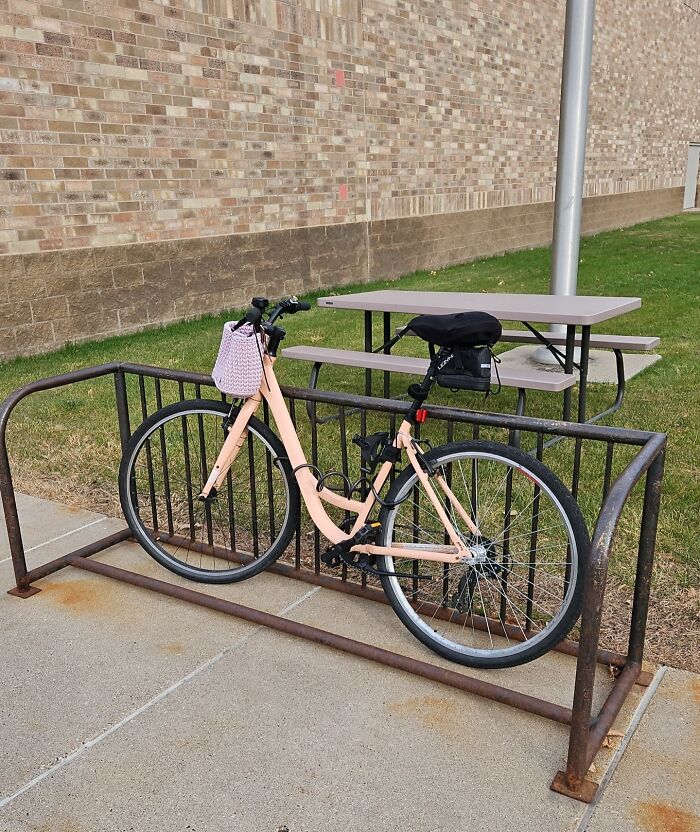 A bike locked outside, blocking access, illustrating people being jerks.