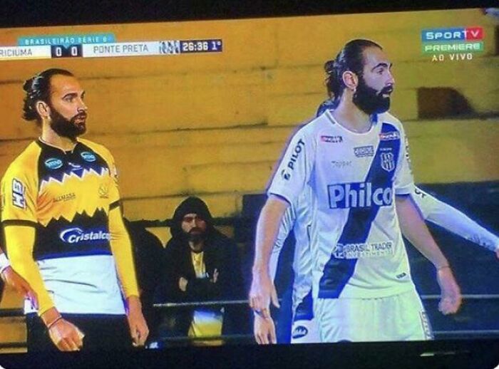 Soccer players resembling doppelgangers on the field, creating a glitch in the matrix effect during a match.