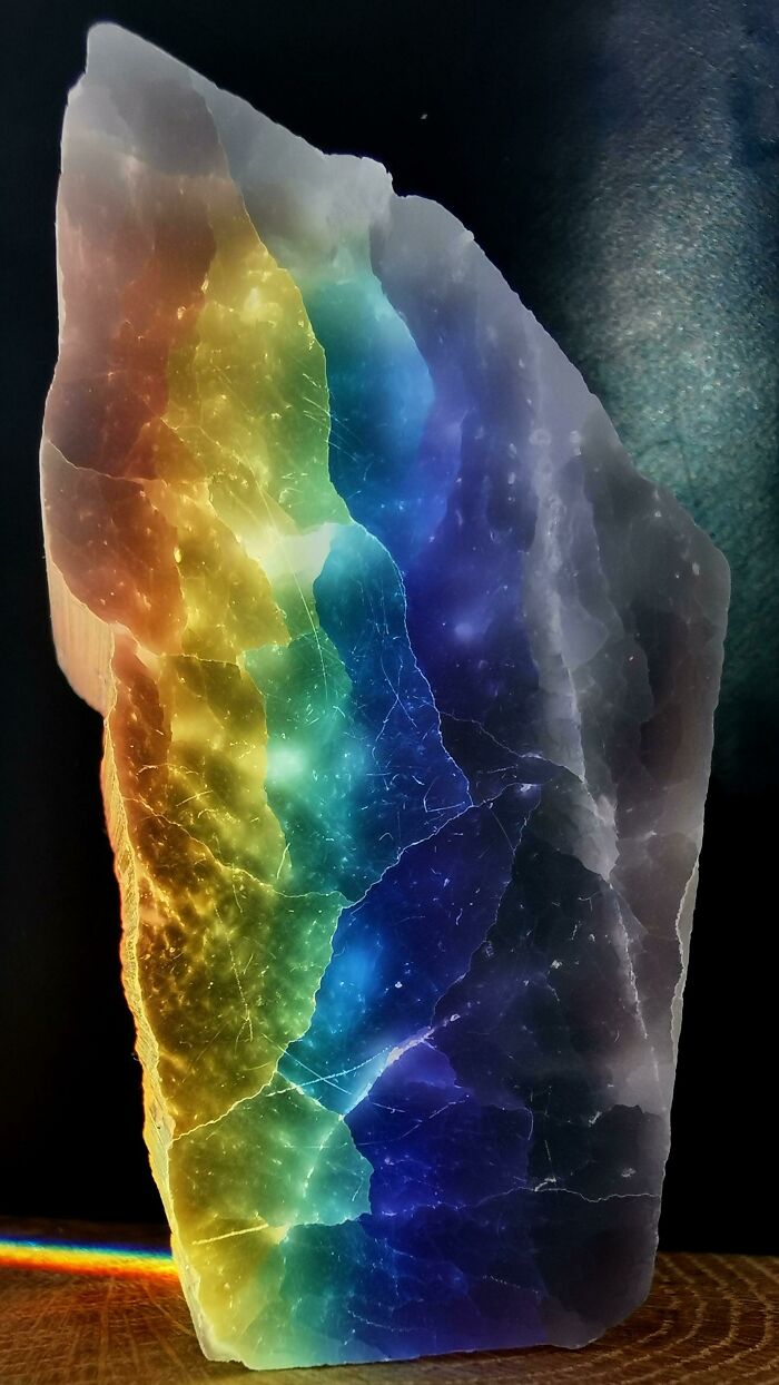 Vibrant rainbow colors in a natural rock formation, showcasing interesting, not photoshopped phenomenon.