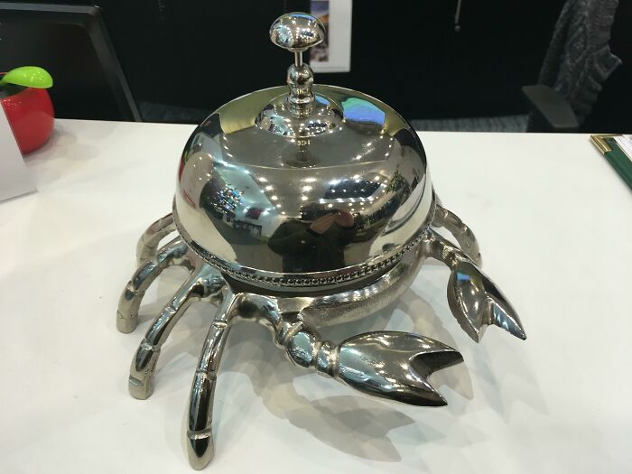 Innovative design of a crab-shaped silver serving dish demonstrating creative designer skills.