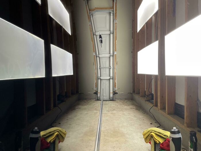 Warped garage door illusion due to interesting reflection, not photoshopped, creating a visually intriguing perspective.