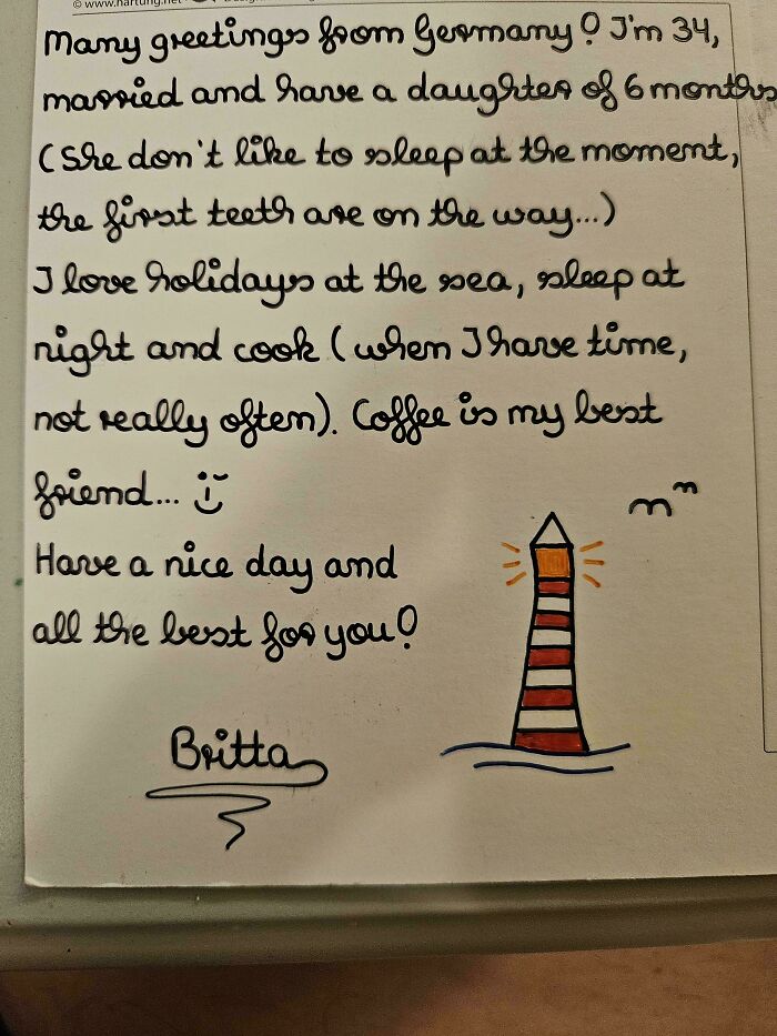 Beautiful handwriting sample featuring a personal note with lighthouse doodle and neat cursive script.