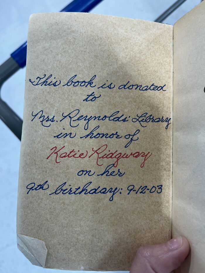 Elegant handwriting dedicating a book to Mrs. Reynolds Library in honor of Katie Ridgway's 9th birthday, dated 9-12-03.