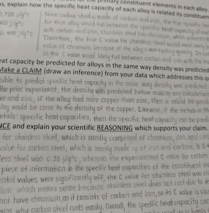 Neatly handwritten notes showcasing excellent handwriting skills on alloy composition and heat capacity.