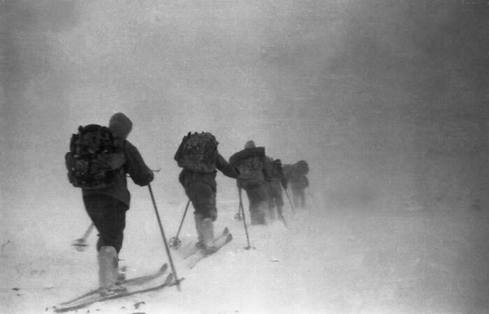 Black and white photo of skiers in a blizzard. One of 81 creepy images that are truly eerie.