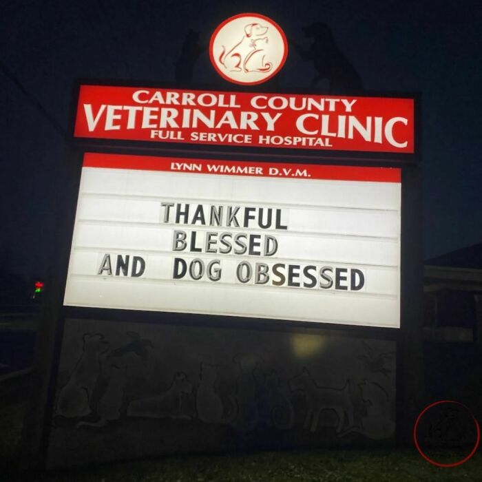 Veterinary clinic sign with the joke: Thankful, Blessed, and Dog Obsessed.
